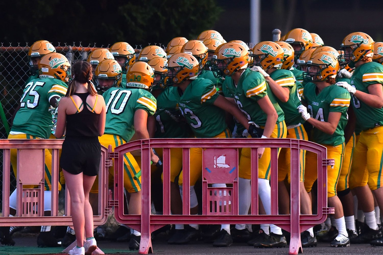 The Tumwater football team prepares to run out onto the field before its home opener against North Kitsap on Sept. 9.